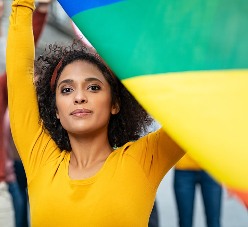 woman holding lgbt flag alt