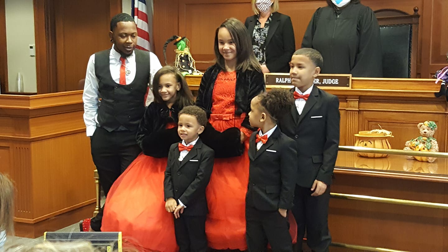 Gay man adopts five siblings because family is forever